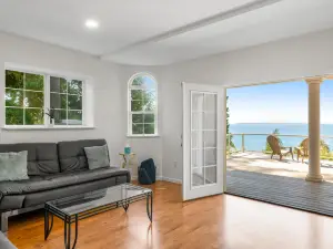 Luxurious dog-friendly water-view home with private beach access & hot tub