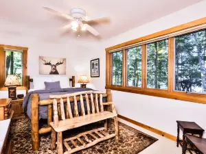 Waterfront getaway with wood fireplace, dock, & lakeside deck