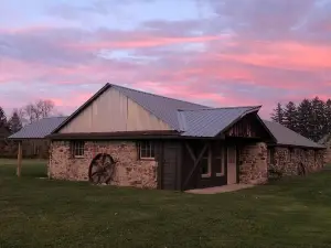 Cozy up in this rustic Stone Lodge and relax by the fireplace