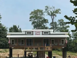 NEW.  CADDO SHACK  on caddo river bank in gated community.