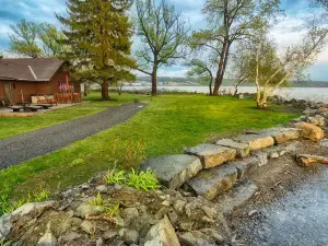 Almost an island in Cayuga Lake! Private & panoramic 650' of level lake frontage