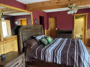 Ausable River waterfront 4-bed house in Grayling w/dock, patio, firepit, garage.