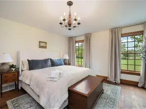 Exquisite Cape Cod home with large yard, fireplace, central AC, & W/D
