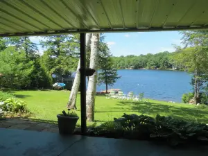 Beautiful lakeside 4 bedroom retreat with private dock and walkout basement
