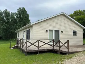 Big Stone Lake views and next door access to public boat ramp.