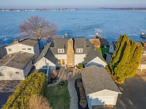 Beautifully updated home on the bay and golf course with dock and raised deck!