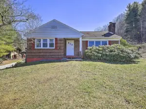 Quaint Creekside Home w/ Spacious Deck & Yard