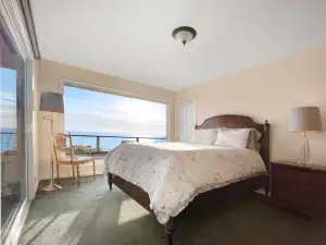 Oceanfront home with private hot tub, views, & close beach access