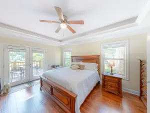 Inviting waterfront home with fireplace, dock, patio, central AC, & W/D