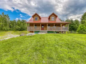 Bright three-level home with water views, jetted tub, firepit, and pool table