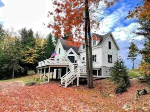 Sunsets, Sandy Beach and Seclusion; enjoy them all at this stunning lake house