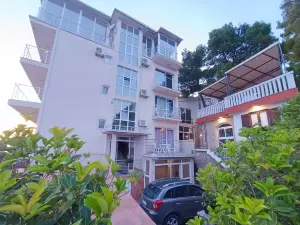 An apartment in a complex in a pine forest