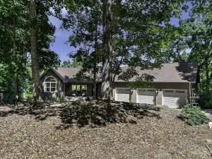 This wooded retreat has everything! Spring and Summer right around the corner!