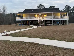 Accessible lake-front 4 bedroom home with TONS of outdoor covered space!