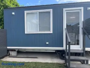 Sweet Cute Blue Tiny Home with Pool and 2 Minute Drive to the Beach