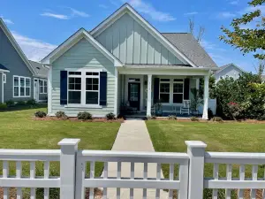 Perfect Single Level Spacious Layout Coastal Retreat Featuring Resort Style Pool