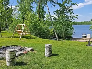 Beautiful Log Cabin With Sandy Beach.  Lake Is Known For Its Great Fishing!