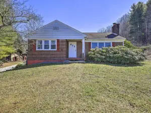 Quaint Creekside Home w/ Spacious Deck & Yard