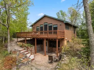 Lakefront retreat on Island Lake. Two cabins, 7 bedrooms, sand beach, privacy+++