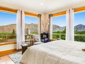 Stunning home on 20 acres with orchard views, lovely patio/balcony & sunroom