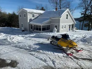House with private sandy beach & dock plus hiking and snowmobile access