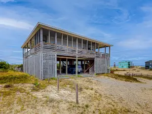 Ocean-view home with wrap-around deck, beach access, outdoor shower & cornhole