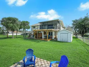 Modern Waterfront Lakehouse, with a Private Beach and a Spacious Boat Dock.
