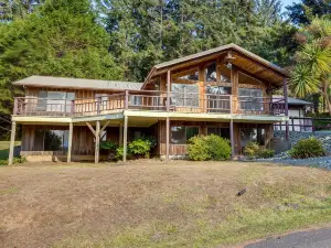 Tree-Lined Gold Beach Retreat with Multiple Decks!