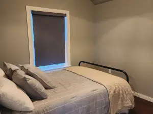 Small cottage house, centered on 100 acres surround by hills, lake, and cattle.