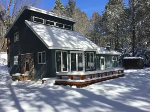 Northwoods Lake Home with Gentle Slope to Clear Lake with Sandy Beach