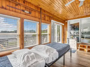 Lakefront Cottage with kayaks, paddleboat, aqua mat, & BIG deck close to Elkhart