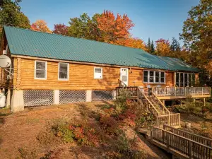 Private, on the water beautiful log cabin, 815 feet of water frontage, 16 acres