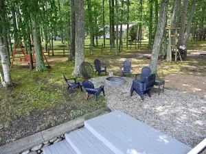 Spacious vacation home on large private wooded lot on crystal clear Hubbard Lake