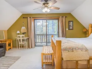 Stunning two-story home in the trees w/ a firepit, furnished deck, & balcony