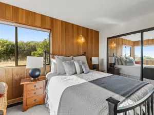 Luxe retreat with ocean views, hot tub, & gourmet kitchen - steps from beach