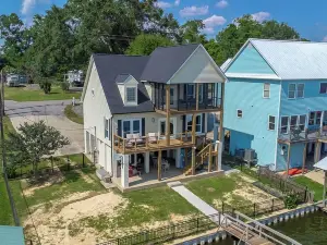 It's About River Time, a 3BR/3BA house on False River, fenced yard & large pier!