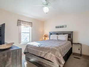 Inviting lake view home with fireplace, golf nearby, full kitchen, & W/D