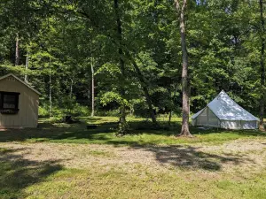 Custom Design Safari Tent Overlooking a Serene Running Creek & Natural Waterfall