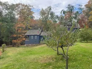 Cottage beside a waterfall