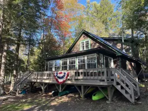 Cozy  Sebec Lake front cabin with dock and fire pit
