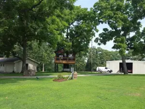 Large private acreage, very open space, decks, hot tub, treehouse, dock, more.