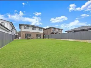 Center of Rouse Hill house with back yd
