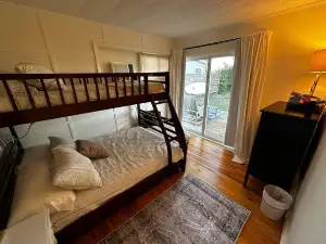 Mid-Century Rivah Retreat with Dock, Fire Pit & Cozy Fireplace