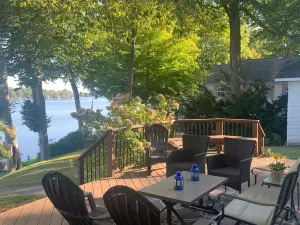 Gorgeous Sandy Beachfront Paw Paw lake home with 155 ft. of frontage and dock