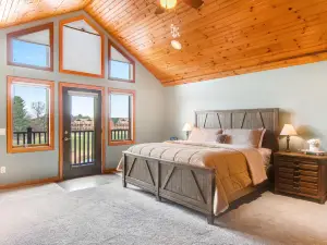 Riverfront golf resort condo with pool, hot tub, volleyball, & fairway-view deck