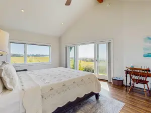 Luxurious, new coastal home w/modern kitchen, sweeping ocean and pastoral views