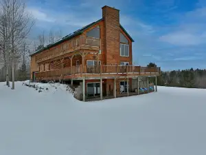 Beautiful Home and property on 50 acres next to golf, amusement park & trails.