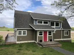 Sleeps groups to 12!  Modern open spaces.  Yoga loft. Deck. Kitchen. Peaceful.