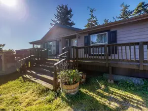 Serene waterfront haven with lake views, fenced yard & home office