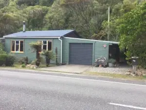 Nestled in the beautiful New Zealand bush a classic Kiwi bach.